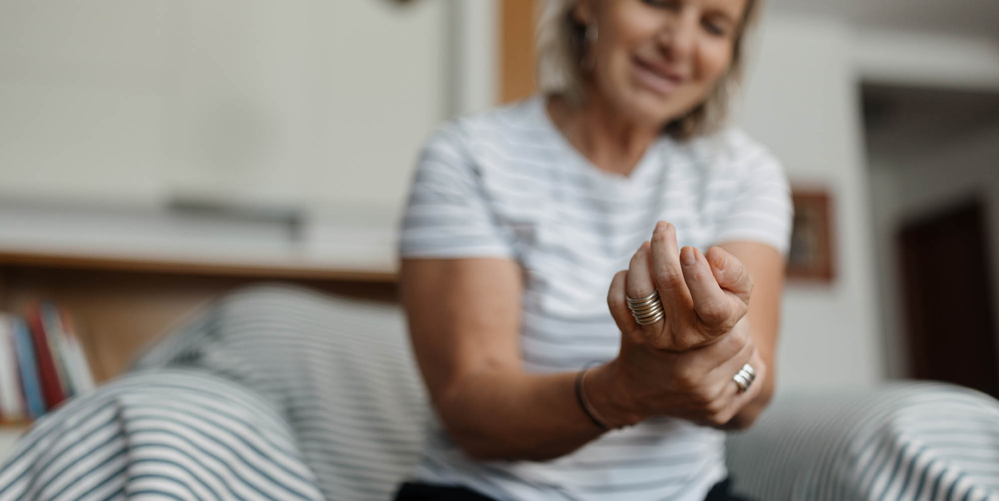 Woman holding her arm in pain