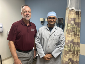 Heart surgeon with patient