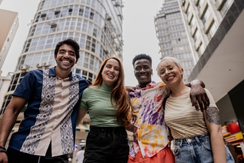 Young adults smiling - no colorectal cancer here!