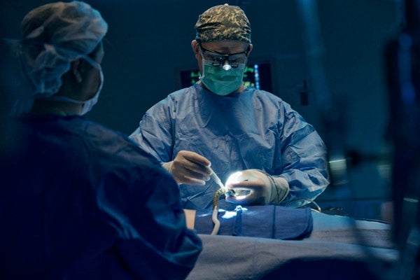 Cardiac surgeon performing