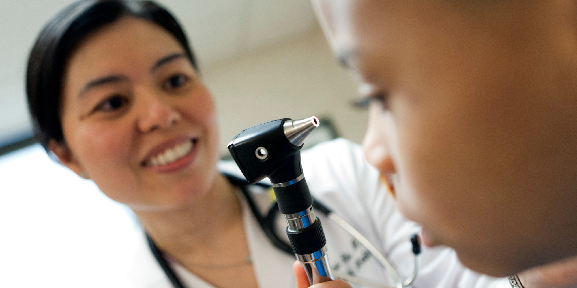 Loyola physician examining a patient