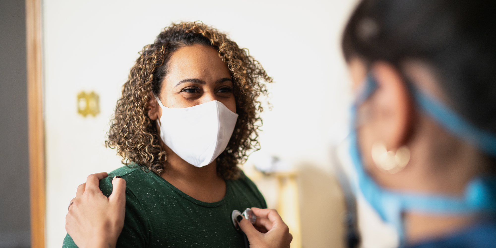 Medical provider examining a woman