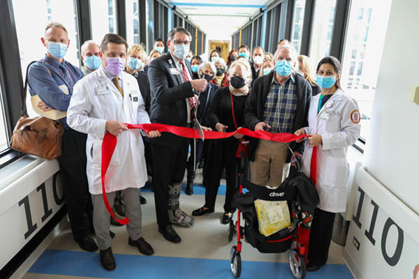 Chris and Neil Blitstein Rehabilitation Track cutting ribbon