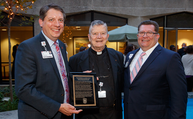 Tad Gomez, President, Loyola University Medical Center, Father Jack O'Callaghan and Shawn P. Vincent, President and CEO, Loyola Medicine