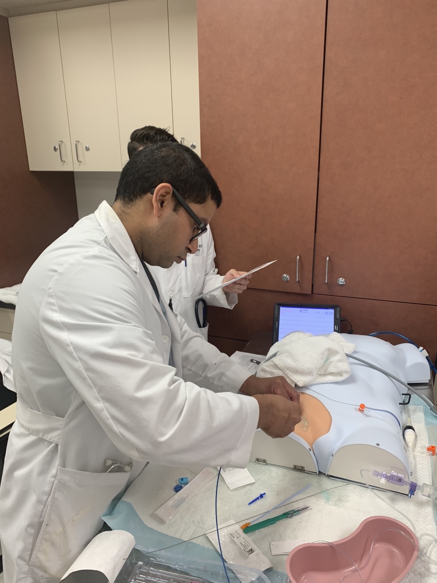 Residents practicing surgery techniques