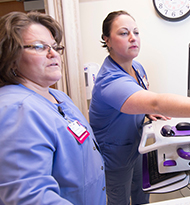 Two nurses working together