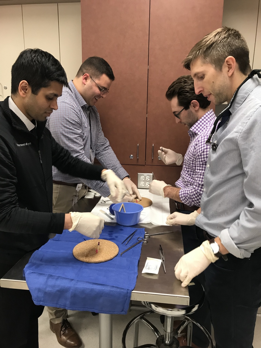 Residents practicing surgery techniques